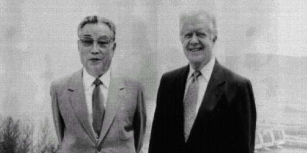 Former President Jimmy Carter (R) poses with North Korean President KimIl-sung in Pyongyang June 17. JAPAN OUT st/KNS-Kyodo REUTERSAS