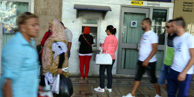 A woman uses a cash machine in downtown Tunis, Tunisia, September 21, 2017 REUTERS/Zoubeir Souissi