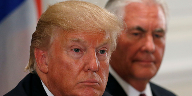 U.S. President Donald Trump and U.S. Secretary of State Rex Tillerson (R) attend a working dinner with Latin American leaders in New York, U.S., September 18, 2017. REUTERS/Kevin Lamarque