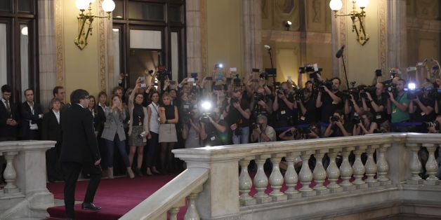 Catalan regional government president Carles Puigdemont arrives to address the Catalan regional parliament in Barcelona on October 10, 2017.Spain's worst political crisis in a generation will come to a head as Catalonia's leader could declare independence from Madrid in a move likely to send shockwaves through Europe. / AFP PHOTO / LLUIS GENE (Photo credit should read LLUIS GENE/AFP/Getty Images)