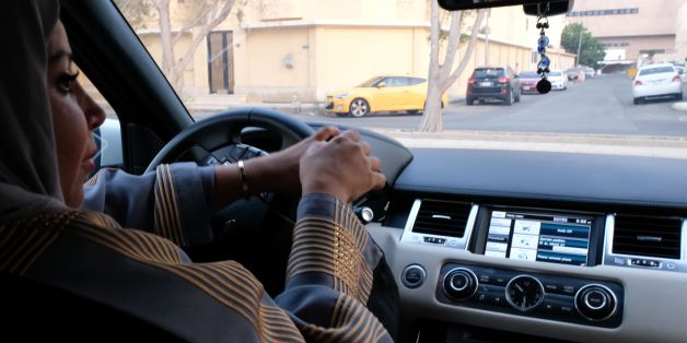 A Saudi woman drives her car along a street in the Saudi coastal city of Jeddah, on September 27, 2017.
Saudi Arabia will allow women to drive from next June, state media said on September 26, 2017 in a historic decision that makes the Gulf kingdom the last country in the world to permit women behind the wheel. / AFP PHOTO / REEM BAESHEN (Photo credit should read REEM BAESHEN/AFP/Getty Images)