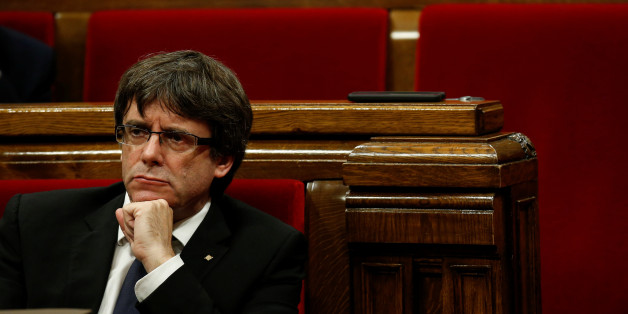 Catalan President Carles Puigdemont gestures during a plenary session in the Catalan regional parliament in Barcelona, Spain, October 10, 2017. REUTERS/Albert Gea