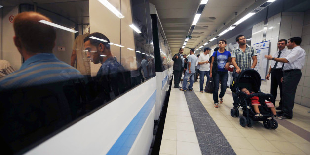 ADDING BYLINEWould be passengers walk on the platform near a metro carriage in La Grande Poste station in Algiers' new underground network on August 18, 2011 during an informative evening orgainised by the the transport authorities to familiarise commuters with the new line. AFP PHOTO / FAROUK BATICHE (Photo credit should read FAROUK BATICHE/AFP/Getty Images)