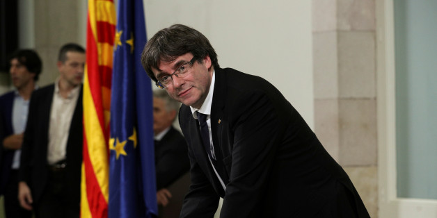 Catalan President Carles Puigdemont signs a declaration of independence at the Catalan regional parliament in Barcelona, Spain, October 10, 2017. REUTERS/Albert Gea TPX IMAGES OF THE DAY