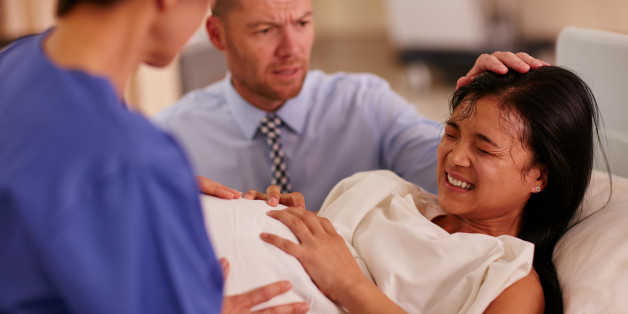 Shot of a young woman giving birth with her husband supporting her in the backgroundhttp://195.154.178.81/DATA/i_collage/pu/shoots/806395.jpg
