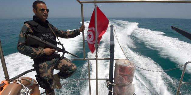 A member of the Tunisia's national guard patrols the sea bordering Tunisia and Libya for vessels potentially carrying migrants trying to reach Europe on May 5, 2015 off the coast of Tunisia's southeast port of Zarzis. AFP PHOTO/FETHI BELAID (Photo credit should read FETHI BELAID/AFP/Getty Images)