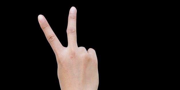 right back hand a woman show the second, number two, fight, encouragement sign. isolated on black background