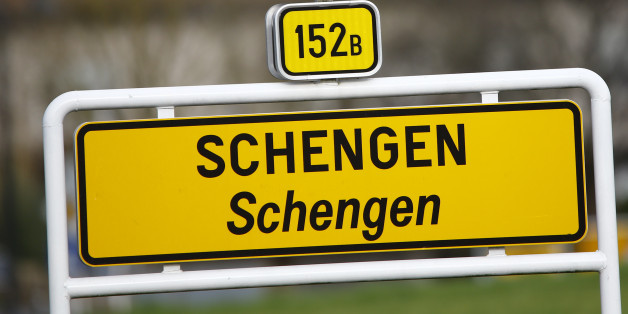A street sign marks the beginning of the village of Schengen, Luxembourg January 27, 2016. The Schengen Agreement with the goal to eliminate internal border controls was signed on June 14, 1985 in the small village at the river Moselle and the tripoint of France, Germany and Luxembourg between the five countries of Belgium, France, Germany, Luxembourg and the Netherlands. European Union interior ministers are to discuss extending temporary border controls in the passport-free Schengen zone to control migration flows, as well as identity document fraud following France's request to improve the detection of fake Syrian passports used by people trying to get into Europe. REUTERS/Wolfgang Rattay
