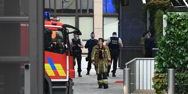 Belgian rescue personnel gather at The European Council in Brussels on October 13, 2017, after noxious fumes in the kitchen led to kitchen staff falling ill.
Some 15 people were intoxicated following a ventilation problem in the kitchen of the Europa Building, the place were European leaders are due to meet October 19-20, 2017. / AFP PHOTO / EMMANUEL DUNAND (Photo credit should read EMMANUEL DUNAND/AFP/Getty Images)