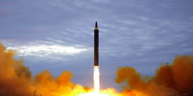 TOPSHOT - This picture from North Korea's official Korean Central News Agency (KCNA) taken on August 29, 2017 and released on August 30, 2017 shows North Korea's intermediate-range strategic ballistic rocket Hwasong-12 lifting off from the launching pad at an undisclosed location near Pyongyang.Nuclear-armed North Korea said on August 30 that it had fired a missile over Japan the previous day, the first time it has ever acknowledged doing so. / AFP PHOTO / KCNA VIA KNS / STR / South Korea OUT /