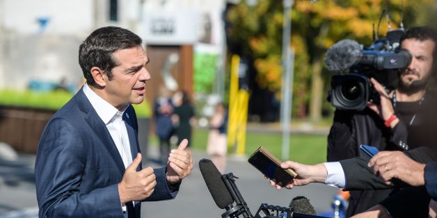 Prime Minister of Greece, Alexis Tsipras, talks to the media as he arrives at the Tallinn Digital Summit in Tallinn, Estonia, on September 29, 2017.
EU leaders hold a digital summit in the Estonian capital with French President Emmanuel Macron seeking to persuade his counterparts to overhaul European tax rules targeting Silicon Valley firms. / AFP PHOTO / Ilmars ZNOTINS (Photo credit should read ILMARS ZNOTINS/AFP/Getty Images)