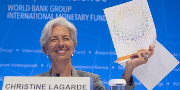 IMF Managing Director Christine Lagarde holds up the Global Policy Agenda during a press conference during the World Bank Group / International Monetary Fund Annual Meetings at IMF Headquarters in Washington, DC, October 12, 2017. / AFP PHOTO / SAUL LOEB (Photo credit should read SAUL LOEB/AFP/Getty Images)