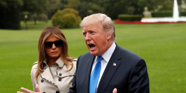 First Lady Melania Trump looks on as U.S. President Donald Trump speaks to reporters upon his departure from the White House in Washington, U.S., October 13, 2017. REUTERS/Kevin Lamarque