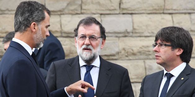 (From L) Spain's King Felipe VI, Spanish Prime Minister Mariano Rajoy, President of Catalonia Carles Puigdemont arrive for a mass to commemorate victims of two devastating terror attacks in Barcelona and Cambrils, at the Sagrada Familia church in Barcelona on August 20, 2017.A grief-stricken Barcelona prepared today to commemorate victims of two devastating terror attacks at a mass in the city's Sagrada Familia church. As investigators scrambled to piece together the attacks which killed 14 peop