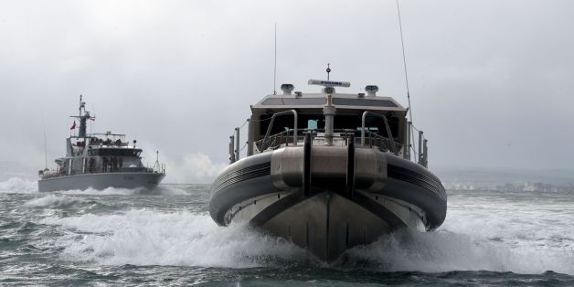 Tunisian soldiers navigate two of six ships given by the US military as they arrive at the Bizerte naval base on the northern coast of Tunisia on January 16, 2017.
The Tunisian army received US military equipment to battle jihadists and illegal immigration. / AFP / FETHI BELAID (Photo credit should read FETHI BELAID/AFP/Getty Images)