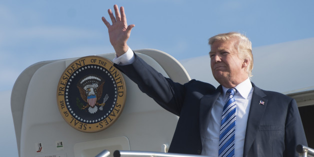 US President Donald Trump disembarks from Air Force One upon arrival at Tri-State Airport in Huntington, West Virginia, August 3, 2017, as he travels to a Make America Great Again Rally. / AFP PHOTO / SAUL LOEB (Photo credit should read SAUL LOEB/AFP/Getty Images)