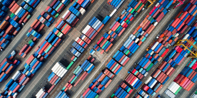 Shipping containers sit stacked in this aerial photograph taken above the Busan Port Terminal (BPT) in Busan, South Korea, on Monday, July 17, 2017. South Korea's exports will continue to rise in July and the third quarter as global trade continues to recover and unit costs rise, especially in sectors including semiconductors, vessels, petroleum goods and steel, according to a statement from the trade ministry. Photographer: SeongJoon Cho/Bloomberg via Getty Images