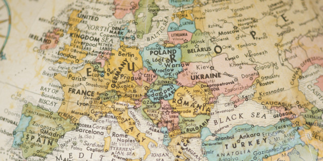 Selective focus view of vintage antique map of Europe on a faded sepia antique globe