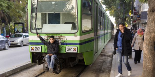 Tunis, Tunisian Republic, January 3, 2015. -- A stowaway on a the so called 'Metro' (Tram) of Tunis. (Photo by Thierry Tronnel/Corbis via Getty Images)