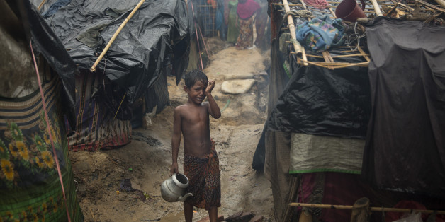 THAINKHALI, BANGLADESH - OCTOBER 7: A Rohingya boy cries as monsoon rains continue to batter the area causing more difficulties October 7, Thainkhali camp, Cox's Bazar, Bangladesh. Well over half a million Rohingya refugees have fled into Bangladesh since late August during the outbreak of violence in Rakhine state causing a humanitarian crisis in the region with continued challenges for aid agencies. (Photo by Paula Bronstein/Getty Images)