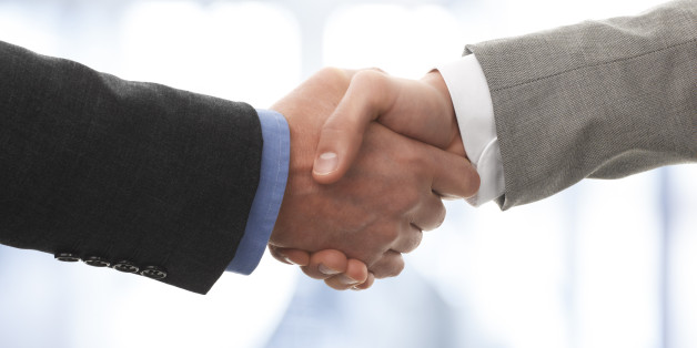 Two business men shaking hands