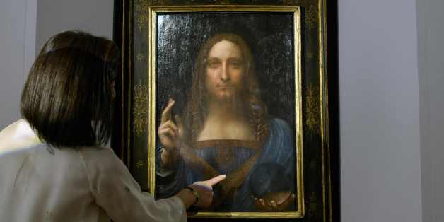 A Christies representative speaks after Leonardo da Vinci's 'Salvator Mundi' painting was unveiled in Hong Kong on October 13, 2017. / AFP PHOTO / Anthony WALLACE / RESTRICTED TO EDITORIAL USE - MANDATORY MENTION OF THE ARTIST UPON PUBLICATION - TO ILLUSTRATE THE EVENT AS SPECIFIED IN THE CAPTION (Photo credit should read ANTHONY WALLACE/AFP/Getty Images)