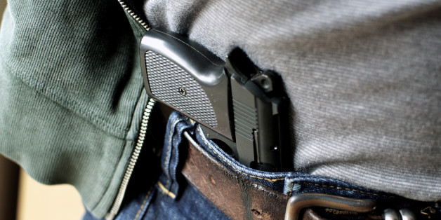 Tucked in a belt pistol being concealed