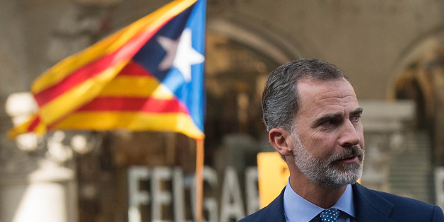 BARCELONA, SPAIN - AUGUST 26: King Felipe VI of Spain arrives to a demonstration against the last week's terrorist attacks next to a Catalonia Pro-Independence flag in the background on August 26, 2017 in Barcelona, Spain. Hundreds of thousands people have marched in central Barcelona for the 'No tinc Por' (I am not afraid) joining in solidarity with the 14 victims of last week's terrorists attacks in Barcelona and Cambrils. 14 people were killed and dozens of injured in two terrorist attacks o