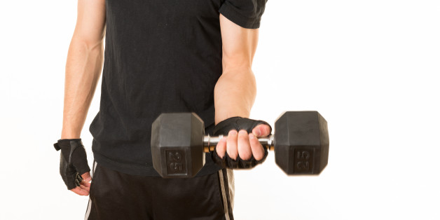 TORONTO, ONTARIO, CANADA - 2012/03/24: Healthy habits: Young adult exercising with a 25 pounds weight. Healthy lifestyle. Fitness and strengh of a teenager. Physical preparation for the future. (Photo by Roberto Machado Noa/LightRocket via Getty Images)