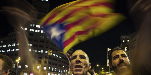 BARCELONA, SPAIN - OCTOBER 21: Waving Catalan flags and shouting here at national Spanish network TVE crew, massive crowd rally to demand the release of imprisoned Catalan leaders Jordi Sanchez and Jordi Cuixart at a demonstration for Catalan independence on October 21, 2017 in Barcelona, Spain. The Spanish government announced measures today it will implement in triggering Article 155, which would lead to the imposition of direct rule by Spanish authorities in Catalonia and at least temporaril