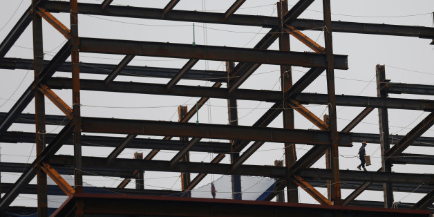 A worker is seen at a construction site for a financial building in Seoul, South Korea May 11, 2017. REUTERS/Kim Kyung-Hoon