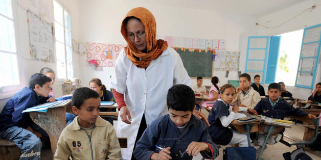A Tunisian teacher supervises a class of Muslim and Jewish students at the national school in Djerba on May 12, 2009. Tunisia's Jewish community marks this week the third anniversary of the Al-Qaeda suicide bombing that racked this sleepy island resort, desecrating an ancient synagogue and killing 21 people. More than 4000 Jewish pilgrims are expected, including 1000 Israelis, on the island of Djerba 10 and 12 May in a rare pilgrimage to an Arab country. AFP PHOTO / Fethi BELAID (Photo credit should read FETHI BELAID/AFP/Getty Images)