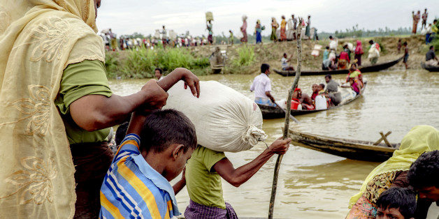 An estimated of 10,000 Rohingya were stranded for three days in "no man's land", the area between the Myanmar and Bangladeshi borders. From a settlement near Anjuman Para, they are seen walking to makeshift refugee camps near Ukhiya in Bangladesh on October 19th, 2017. (Photo by Jade Sacker/NurPhoto via Getty Images)