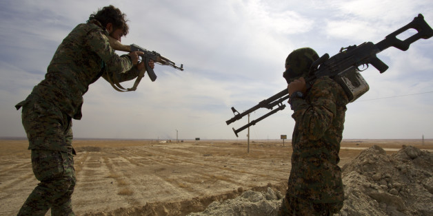 North-East of Syria, Rojava: The Kobani canton, in the Federation of Northern Syria - Rojava, more commonly known as Syrian Kurdistan or Western Kurdistan, struggles against Daesh. Here, two armed soldiers of the People's Protection Units (YPG) near the front line. (Photo by: Andia/UIG via Getty Images)