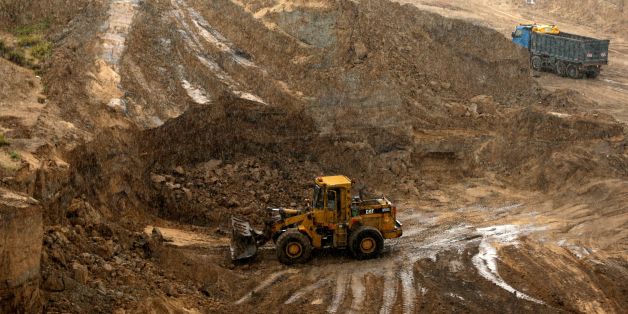 Bulldozers dig at the ancient Tell es-Sakan hill, south of Gaza City, on October 9, 2017.Archaeologists and preservation activists in the Gaza Strip have managed to halt the destruction of the Bronze Age Tell es-Sakan mound site for now, but the future of what remains of the unique site, 'maybe the only fortified Canaanite city in southern Palestine' occupied continuously from 3200 to 2000 BC, may still be in jeopardy. / AFP PHOTO / MAHMUD HAMS (Photo credit should read MAHMUD HAMS/AFP/Ge
