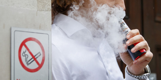 A smoker is engulfed by vapours as he smokes an electronic vaping machine during lunch time in central London on August 9, 2017.
World stock markets and the dollar slid Wednesday after US President Donald Trump warned of 'fire and fury' in retaliation to North Korea's nuclear ambitions, sending traders fleeing to safe-haven investments. In Europe, equities dived with London losing 0.6 percent, while Frankfurt shed 1.1 percent and Paris fell 1.4 percent. / AFP PHOTO / Tolga Akmen (Photo credit should read TOLGA AKMEN/AFP/Getty Images)