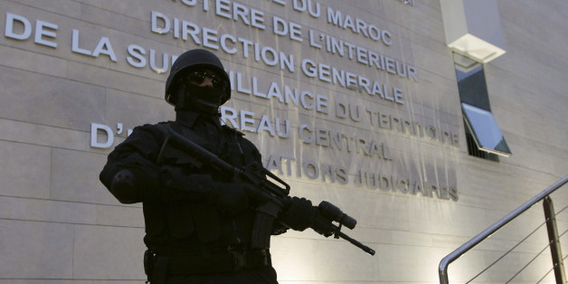 A Moroccan policeman stands guard at the Central Bureau of Judicial Investigation office in Sale, March 23, 2015. Moroccan authorities said on Monday they had dismantled a militant cell planning to create an Islamic State affiliate in the North African kingdom, seizing guns and accusing its members of plotting attacks. Reporters were shown six pistols and ammunition seized from a hideout near the southern city of Agadir, in the offices of the BCIJ in the city of Sale. REUTERS/Stringer