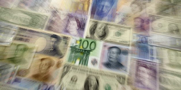 Arrangement of various world currencies including Chinese Yuan, Japanese Yen, US Dollar, Euro, British Pound, Swiss Franc and Russian Rouble pictured in Warsaw January 26, 2011. REUTERS/Kacper Pempel (POLAND - Tags: BUSINESS)