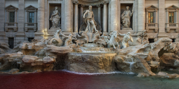 ROME, ITALY - OCTOBER 26: A blood-red dye was poured by public-artist Graziano Cecchini into the Trevi's fountain (Fontana di Trevi) as demonstrative act on October 26, 2017 in Rome, Italy. Rome police identified Graziano Cecchini and placed him under investigation for damaging a historical and artistic building.(Photo by Antonio Masiello/Getty Images)