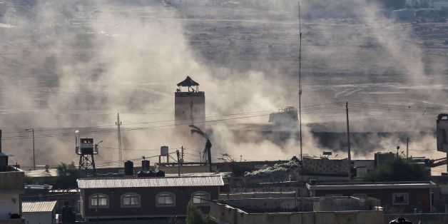 A picture taken on October 23, 2017, in Rafah in the southern Gaza Strip, shows an Egyptian watchtower surrounded in dust as diggers used by the Egyptian army search for tunnels on the Egyptian side of the border with the Palestinian enclave.Three Palestinians who went missing from a tunnel between Egypt and the Gaza Strip in mysterious circumstances on Monday have been located, authorities in the Islamist Hamas-run territory said, after indications they had been kidnapped. / AFP PHOTO / SAID KH