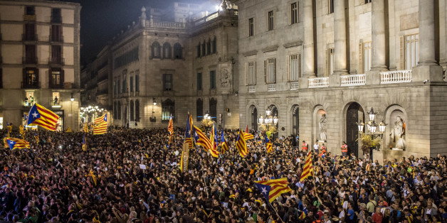 Pro-independence supporters gather at Sant Jaume square to celebrate following the parliamentary vote to declare Catalan independence in Barcelona, Spain, on Friday, Oct. 27, 2017. The resolution approved by lawmakers in Barcelona said the establishment of Europes newest sovereign country had been set in motion. Photographer: Angel Garcia/Bloomberg via Getty Images