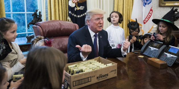 WASHINGTON, DC - OCTOBER 27: President Donald Trump meets with and hands out candy to children of journalists and White House staffers for Halloween in the Oval Office of the White House in Washington, DC on Friday, Oct. 27, 2017. (Photo by Jabin Botsford/The Washington Post via Getty Images)