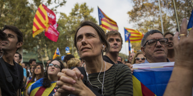 Pro independence supporters react as they wait outside the Catalan parliament for the result of a vote for independence in Barcelona, Spain, on Friday, Oct. 27, 2017. Catalonia is headed for a dramatic confrontation with Spain after the insurgent regions parliament voted to declare independence and the government in Madrid gained the power to oust its separatist leadership. Photographer: Guillem Sartorio/Bloomberg via Getty Images