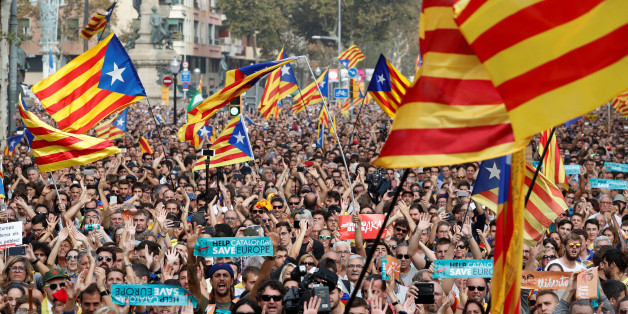 People react while the Catalan regional parliament votes for independence of Catalonia from Spain in Barcelona, Spain October 27, 2017. REUTERS/Yves Herman