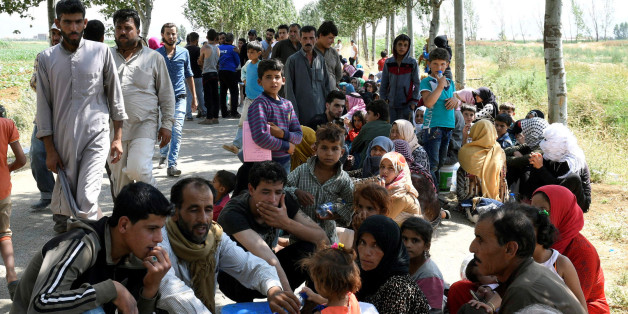 Syrian refugees gather outside their camp after a fire tore through it, near the town of Qab Elias, in Lebanon's Bekaa Valley, July 2, 2017. REUTERS/Hassan Abdallah