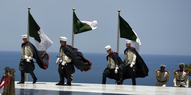 Members of the Algerian Republican Guards arrive at the Martyr's Shrine in the Algerian capital, Algiers, on June 15, 2015 ahead of an official visit by French President Francois Hollande. Hollande arrived in Algeria for a brief visit aimed at tackling the 'common battle' of the once bitter foes against jihadists from Mali to Libya. AFP PHOTO / FAROUK BATICHE (Photo credit should read FAROUK BATICHE/AFP/Getty Images)