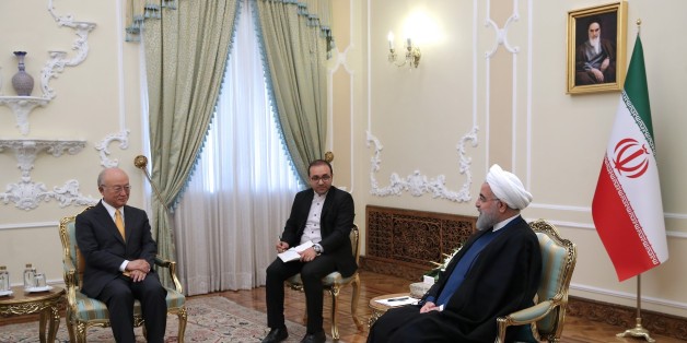 TEHRAN, IRAN - OCTOBER 29: (----EDITORIAL USE ONLY MANDATORY CREDIT - 'IRANIAN PRESIDENCY / HANDOUT' - NO MARKETING NO ADVERTISING CAMPAIGNS - DISTRIBUTED AS A SERVICE TO CLIENTS----) Iranian President Hassan Rouhani (R) shakes hands with Director General of the International Atomic Energy Agency Yukiya Amano (L) ahead of their meeting at the Presidential Palace in Tehran, Iran on October 29, 2017. (Photo by Iranian Presidency / Handout/Anadolu Agency/Getty Images)