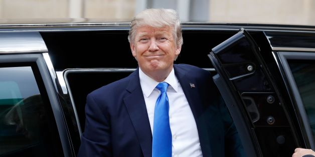 US President Donald Trump gets out of the car as he arrives at the Elysee Palace on July 13, 2017 in Paris for a 24-hour trip that coincides with France's national day and the 100th anniversary of US involvement in World War I.Donald Trump arrived in Paris for a presidential visit filled with Bastille Day pomp and which the White House hopes will offer respite from rolling scandal backing home. / AFP PHOTO / Patrick KOVARIK (Photo credit should read PATRICK KOVARIK/AFP/Getty Images)