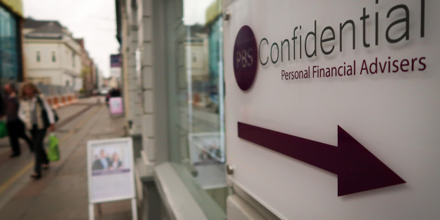 ST HELIER, JERSEY - APRIL 13: People pass the offices of a financial advisors in St Helier on April 13, 2017 in St Helier, Jersey. Jersey, which is not a member of the European Union, is one of the top worldwide offshore financial centres, described by some as a tax haven, as it attracts deposits from customers outside of the island who seek the advantages of reduced tax burdens. In 2008 Jersey's gross national income per capita was among the highest in the world. However, its taxation laws hav