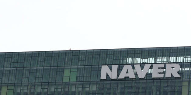 Naver Corp. signage is displayed atop the company's headquarters in Seongnam, South Korea, on Tuesday, April 28, 2015. Naver, the parent company of Line Corp., operator of Japan's most popular instant-messaging platform, is scheduled to report first-quarter results on April 30. Photographer: SeongJoon Cho/Bloomberg via Getty Images